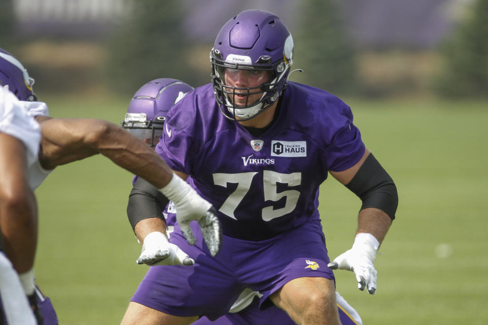 Minnesota Vikings tackle Brian O'Neill (75) blocks during NFL football training camp Friday, July 30, 2021, in Eagan, Minn. (AP Photo/Bruce Kluckhohn)