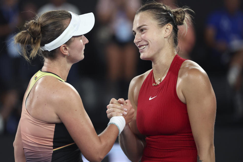 Aryna Sabalenka, right, of Belarus is congratulated by Barbora Krejcikova of the Czech Republic following their quarterfinal match at the Australian Open tennis championships at Melbourne Park, Melbourne, Australia, Tuesday, Jan. 23, 2024. (AP Photo/Asanka Brendon Ratnayake)