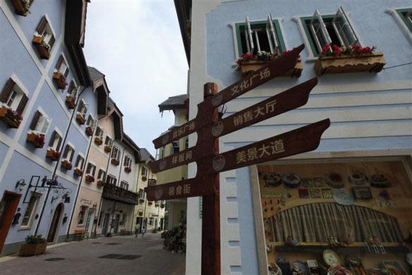 A Chinese road sign is seen at the replica of Austria's UNESCO heritage site, Hallstatt village, in China's southern city of Huizhou in Guangdong province, June 1, 2012.