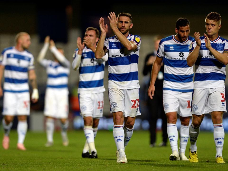 QPR's players celebrate their victory over Millwall: REUTERS