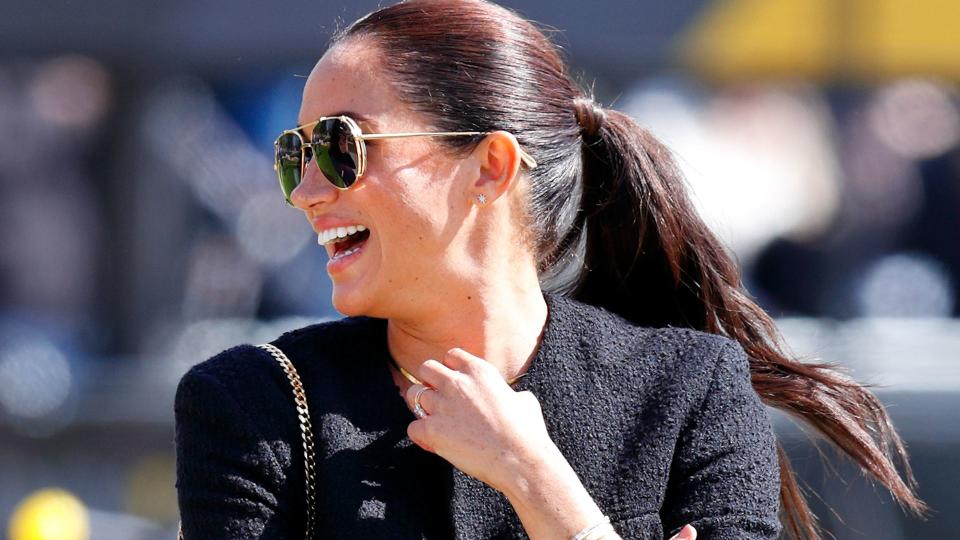 Meghan Markle wearing a navy Celine jacket in 2021