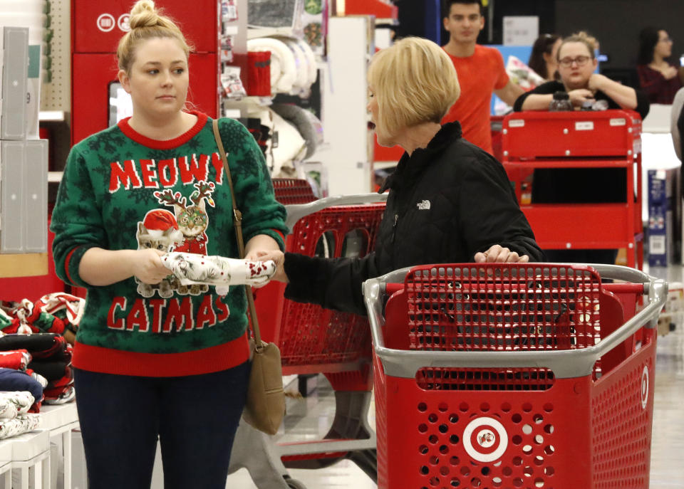 Kinsey McNary, left, shops with her mother Darci McNary a Target store in Frisco, Texas, Friday, Nov. 29, 2019. Black Friday once again kicks off the start of the holiday shopping season. But with it will be the shortest season since 2013 because Thanksgiving fell on the fourth Thursday in November, the latest possible date it could be. (AP Photo/LM Otero)