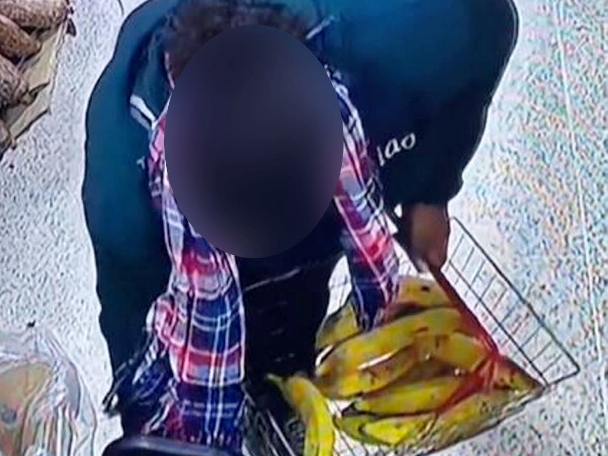 CCTV of one of the suspected shoplifters at Mr Khan’s Authentic Jamaican Food Store in Winson Green, Birmingham. (SWNS)