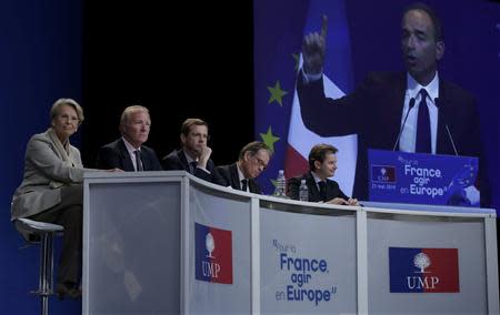 Regional UMP political party candidates (LtoR) Michelle Alliot-Marie, Brice Hortefeux, Alain Cadec, Renaud Musellier and Jerome Lavrilleux listen as French UMP political party leader Jean-Francois Cope delivers his speech during a campaign rally before the European Parliament elections in Paris, May 21, 2014. REUTERS/Jacky Naegelen