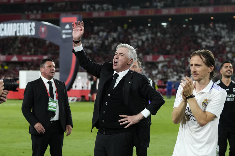 Real Madrid's head coach Carlo Ancelotti celebrates after Madrid defeated Osasuna 2-1 in the Copa del Rey soccer final at La Cartuja stadium in Seville, Spain, Saturday, May 6, 2023. (AP Photo/Jose Breton)