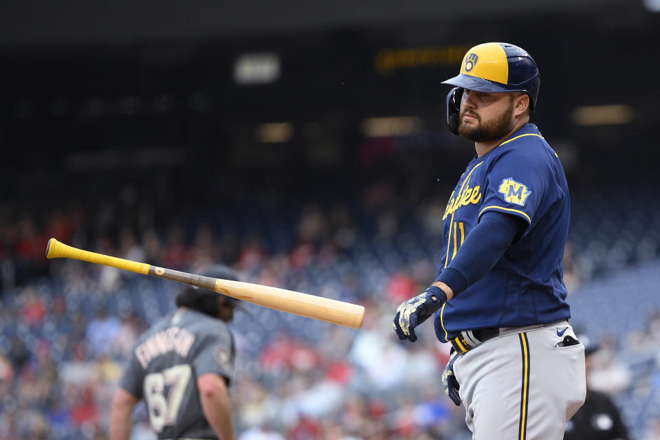 Milwaukee Brewers' Rowdy Tellez throws his bat after he struck out during the seventh inning of the team's baseball game against the Washington Nationals, Saturday, June 11, 2022, in Washington. The Nationals won 8-6. (AP Photo/Nick Wass)