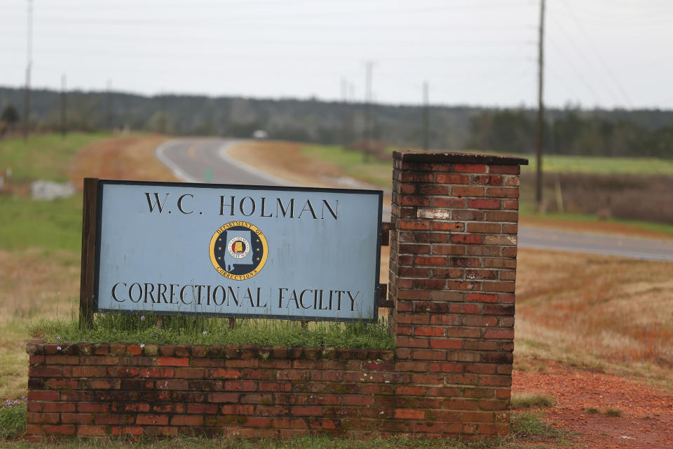 FILE -In this March 12, 2016 file photo, the sign to The William C. Holman Correctional Facility in Atmore, Ala., is displayed. he Justice Department has determined that Alabama's prisons are violating the Constitution by failing to protect inmates from violence and sexual abuse and by housing them in unsafe and overcrowded facilities, according to a scathing report Wednesday, April 3, 2019, that described the problems as "severe" and "systemic."(Sharon Steinmann/AL.com via AP, File)