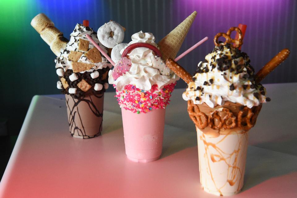 From left the s’mores milkshake, the unicorn milkshake, and the salted caramel milkshake, are seen at Bit Burger in Cedar Bluff, Saturday, July 1, 2023.