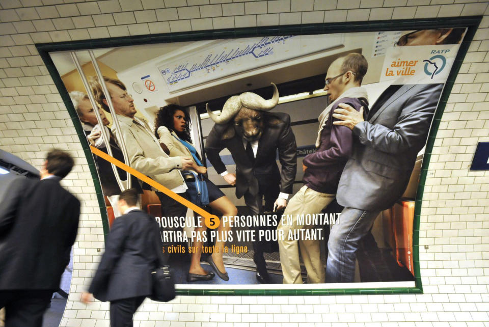 This on Sept. 21, 2011 photo provided by Paris subway operator RATP, shows a campaign poster in a Paris subway station. France, a country famed for its arrogant waiters and proud taxi drivers, is finally getting fed up with rudeness. Polling trends show that impoliteness is now topping lists on causes of stress for the French, who lament that people don't say "thank you" anymore. Paris public transport is weighing in, with a summer-long publicity campaign poking fun at gallic incivility. Poster reads: 'Shoving 5 people out of the way, will not make you go any quicker.' (AP Photo/Bruno Marguerite, RATP)