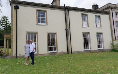 Dunstan Low and Natasha Dobosz outside the raffled home - Credit: Charlotte Graham/Guzelian