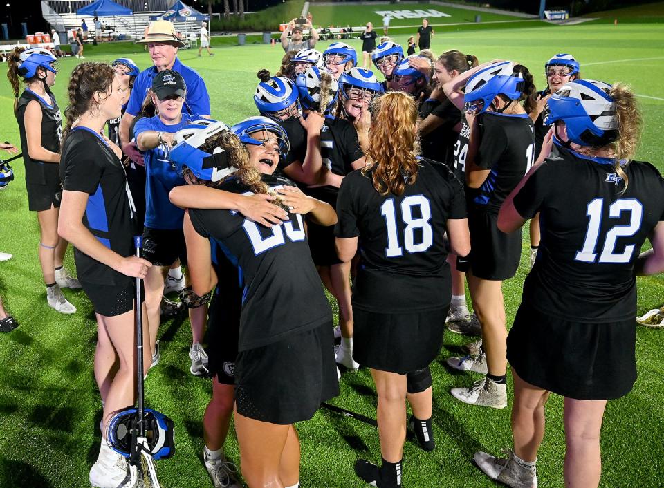Bartram Trail players celebrate winning the Class 2A girls lacrosse championship against Vero Beach in May.