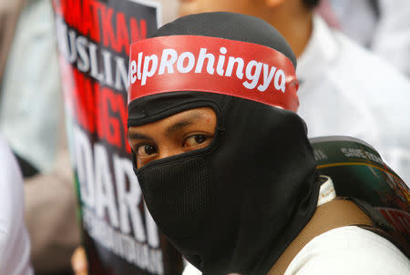 A protesters wears a headband with "Help Rohingya" on it during a demonstration against what organisers say is the crackdown on ethnic Rohingya Muslims in Myanmar, outside the Myanmar embassy in Jakarta, Indonesia November 25, 2016. REUTERS/Iqro Rinaldi