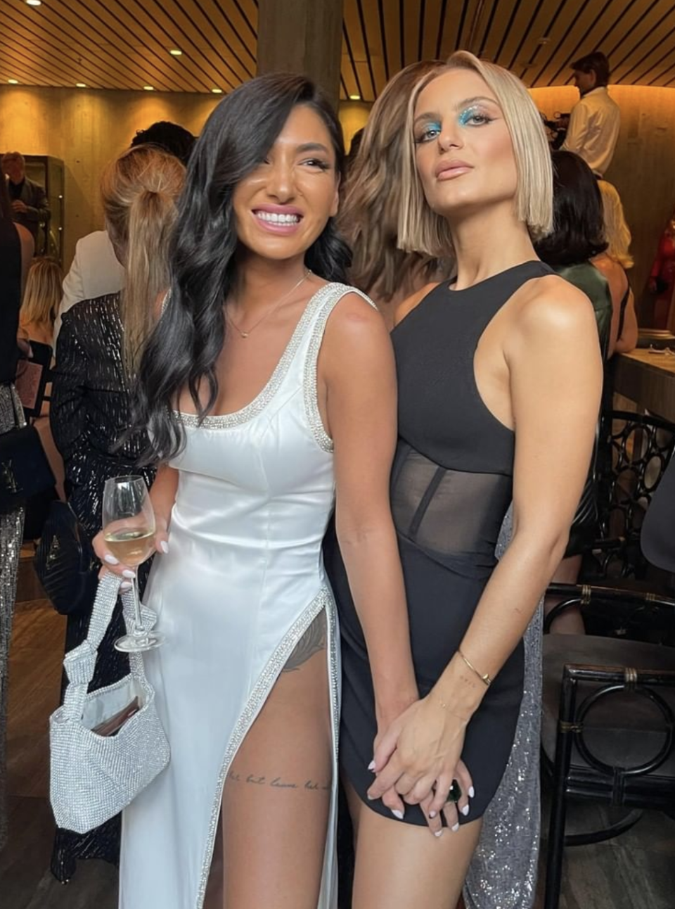 Ella Ding and Domenica Calaraco pose together at an event. 