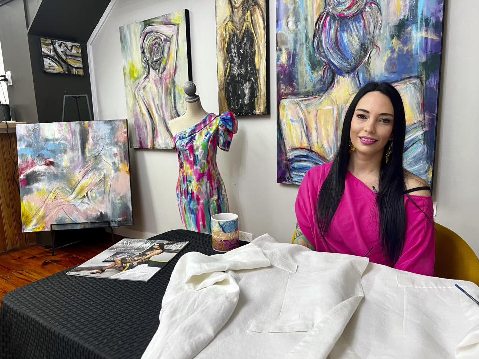 Louisiana artist Mandy Poche poses for a photo at her gallery in Ponchatoula, La., Nov. 1, 2022. (AP Photo/Stephen Smith)