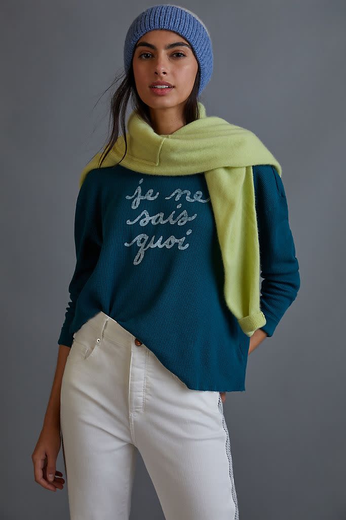 Je Ne Sais Quoi Cropped Sweatshirt. Image via Anthropologie.