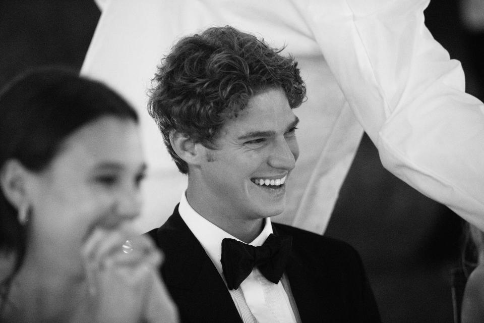 An effervescent smile from my brother, Dylan, as our friends give their toasts.