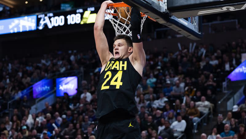 Utah Jazz center Walker Kessler (24) dunks the ball during an NBA game at Vivint Arena in Salt Lake City on Saturday, Feb. 25, 2023.