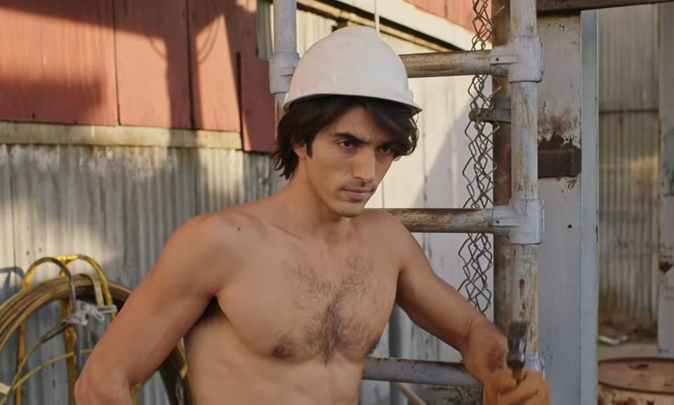 Taylor Zakhar Perez shirtless with a white hardhat on.