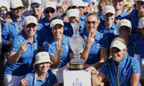 Europe's golf team members pose with the trophy after wining the Solheim Cup golf tournament in Finca Cortesin, near Casares, southern Spain, Sunday, Sept. 24, 2023. Europe has beaten the United States during this biannual women's golf tournament, which played alternately in Europe and the United States. (AP Photo/Bernat Armangue)