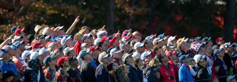 The crowd stares up at a tee shot in the Saturday morning foursomes matches