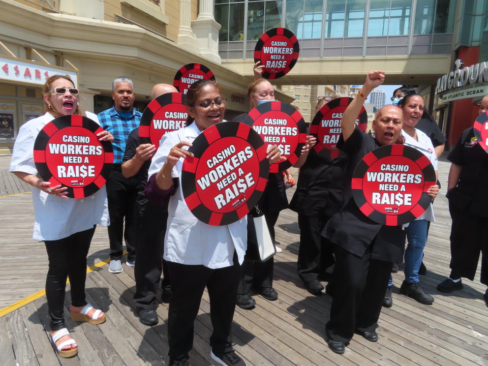 Casino housekeeping workers hold a press conference on the Atlantic City, N.J., Boardwalk on Wednesday, June 8, 2022 at which they accused four casinos of failing to clean each occupied hotel room daily as required by an executive order from New Jersey's governor. (AP Photo/Wayne Parry)