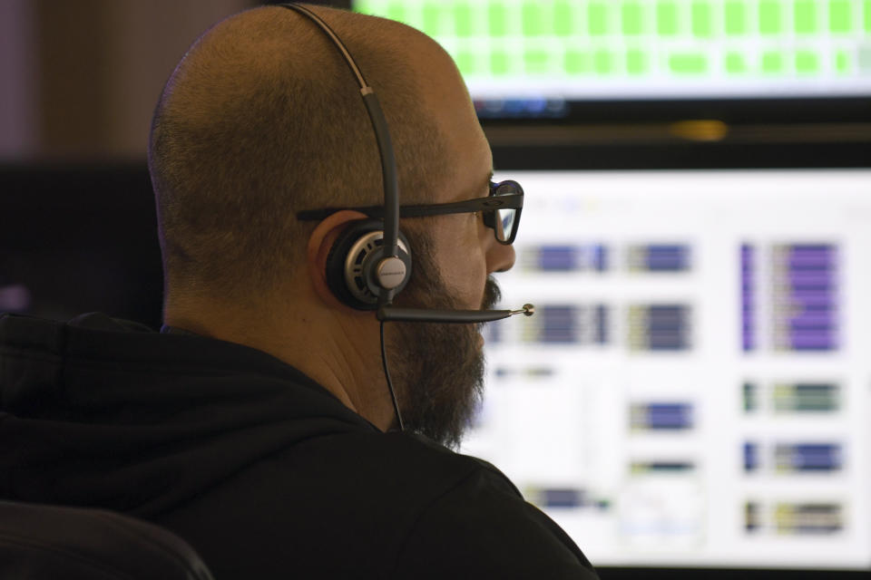 911 dispatcher Nick Arcuri takes a call in Denver on Thursday, Oct. 20, 2022. The city's STAR program uses clinicians and EMTs or paramedics to respond to nonviolent mental health crises, instead of police. Data gathered by The Associated Press show at least 14 of the 20 most populous U.S. cities are hosting or starting such programs, sometimes called civilian, alternative or non-police response teams. They span from New York and Los Angeles to Columbus, Ohio, and Houston, and boast annual budgets that together topped $123 million as of June 2023, the AP found. (AP Photo/Thomas Peipert)