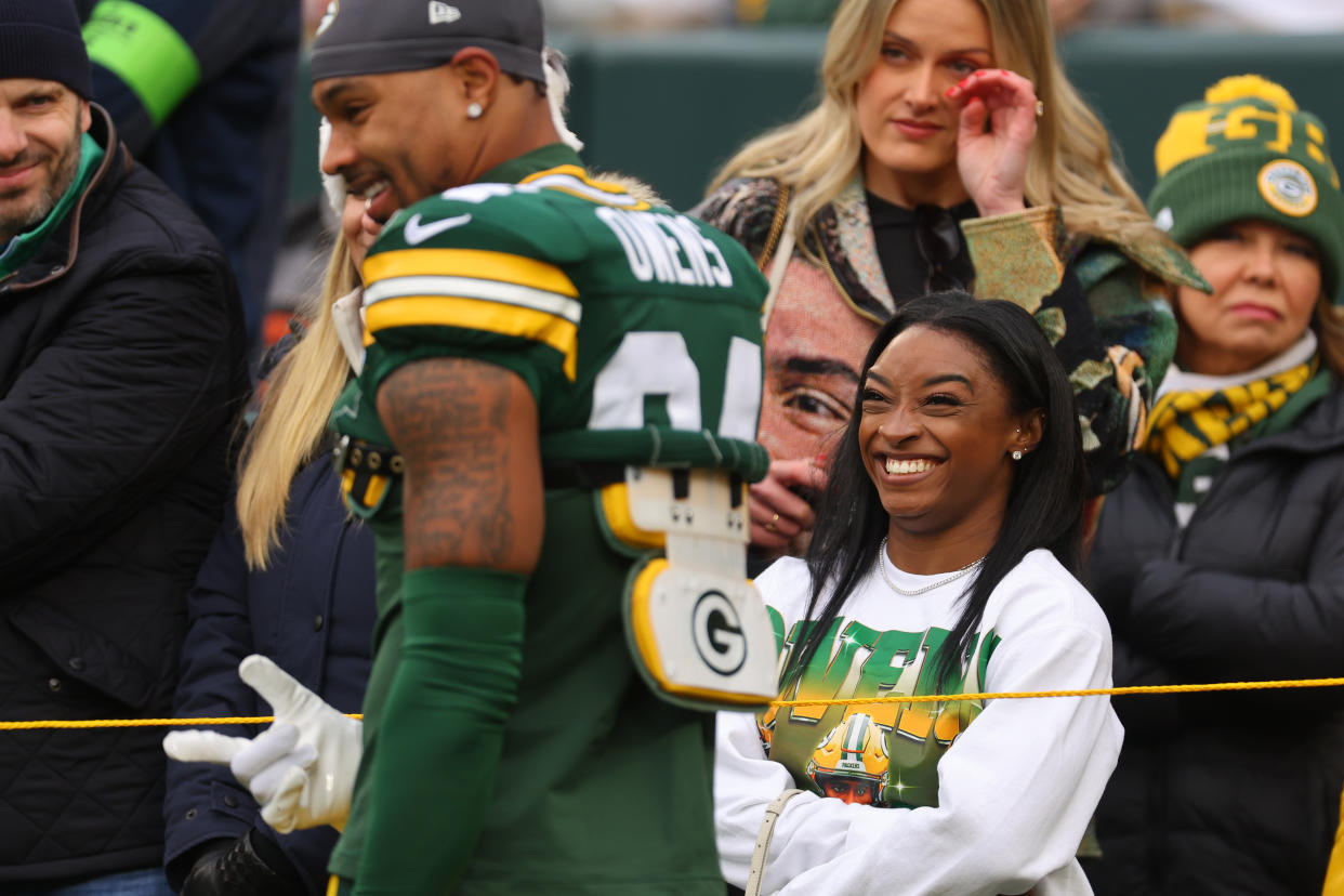GREEN BAY, WISCONSIN - OCTOBER 29: Jonathan Owens #34 of the Green Bay Packers laughs with his wife, Simone Biles, prior to the game against the Minnesota Vikings at Lambeau Field on October 29, 2023 in Green Bay, Wisconsin. (Photo by Michael Reaves/Getty Images)