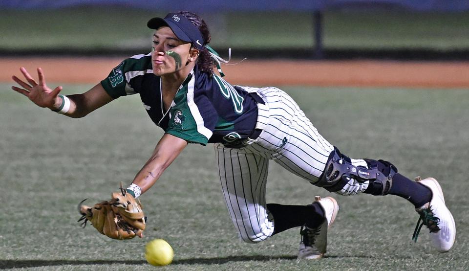 Lakewood Ranch High's Sydney McCray tries to make a diving catch Tuesday night against Parrish Community High in Parrish. The Mustangs edged the Bulls, 4-3.