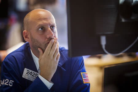 A trader works on the floor of the New York Stock Exchange shortly after the opening bell, July 1, 2015. REUTERS/Lucas Jackson