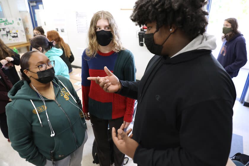 CULVER CITY-CA-OCTOBER 13, 2021: Talaya Poindexter, Abigail Cregor and Mason Merriwether, from left, discuss topics in their ethnic studies class at Culver City High School on Wednesday, October 13, 2021. (Christina House / Los Angeles Times)