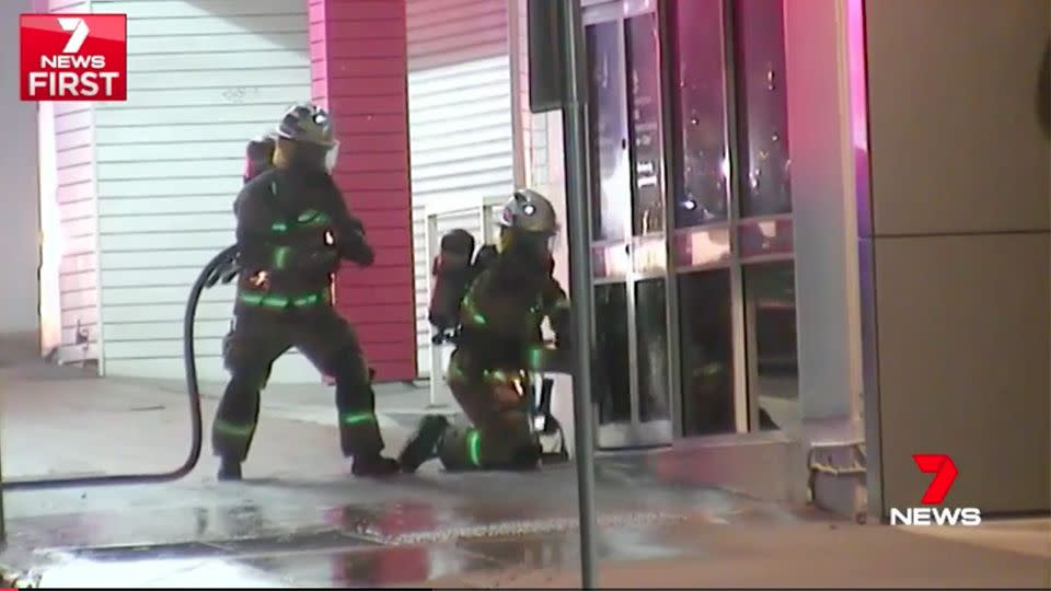 Firefighters smashed through the front door of the bridal store, but it was too late for the hundreds of dresses inside. Source: 7 News