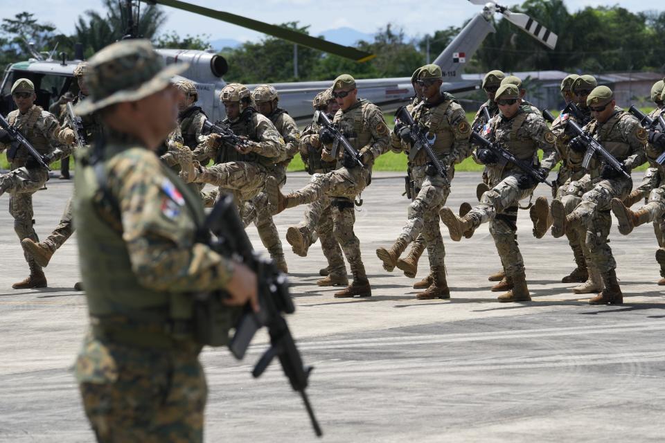 Panamanian border police attend a launch ceremony for Operation Shield in Nicanor, Darien province, Panama, Friday, June 2, 2023. Security officials said Operation Shield is part of the agreement reached with the governments of Colombia and the United States in April to stop the flow of migrants through the border’s jungle-clad mountains known as the Darien Gap. (AP Photo/Arnulfo Franco)