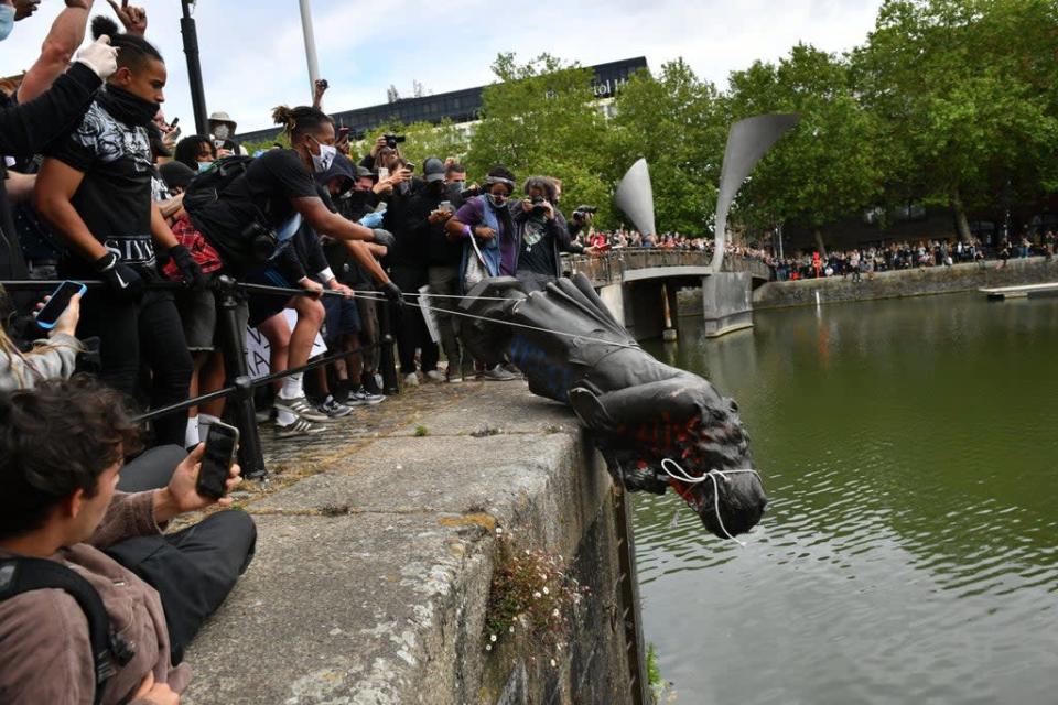 The statue of Edward Colston was pushed into Bristol harbour after being toppled during a Black Lives Matter protest (Ben Birchall/PA) (PA Wire)
