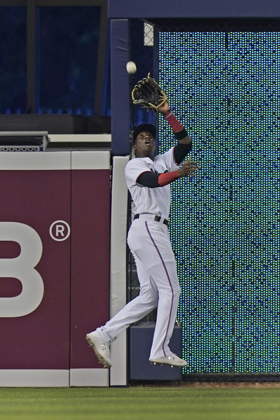 Miami Marlins left fielder Jesus Sanchez catches a ball hit by Los Angeles Dodgers' AJ Pollock during the first inning of a baseball game, Monday, July 5, 2021, in Miami. (AP Photo/Wilfredo Lee)