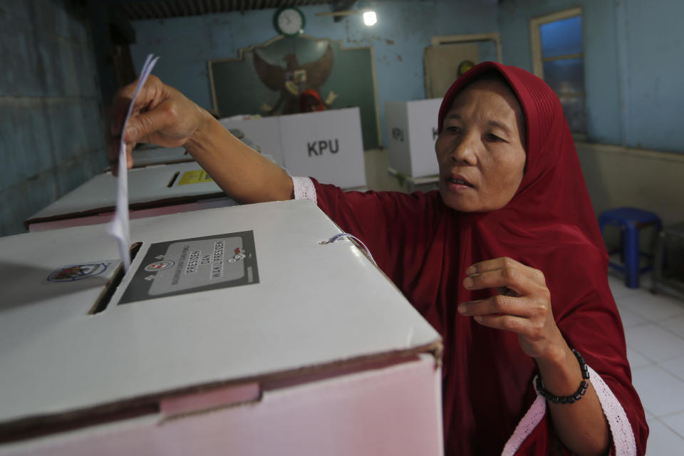 A woman casts her ballot at a polling station during the election in Jakarta, Indonesia, Wednesday, April 17, 2019. The Indonesian presidential election is the world’s biggest direct vote for a national leader. (AP Photo/Tatan Syuflana)