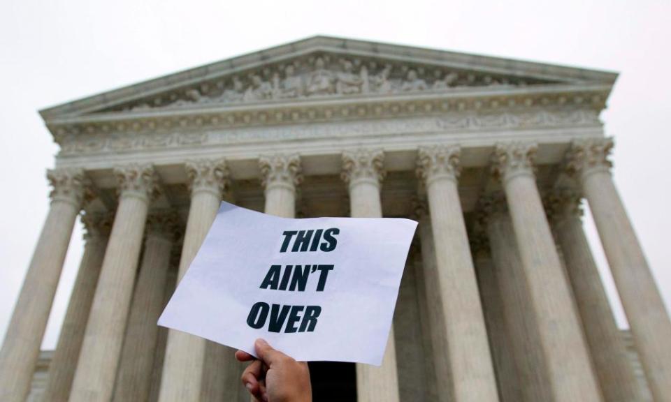 Demonstrators protest at the steps of the US supreme court against the appointment of Brett Kavanaugh in Washington DC on 6 October 2018.