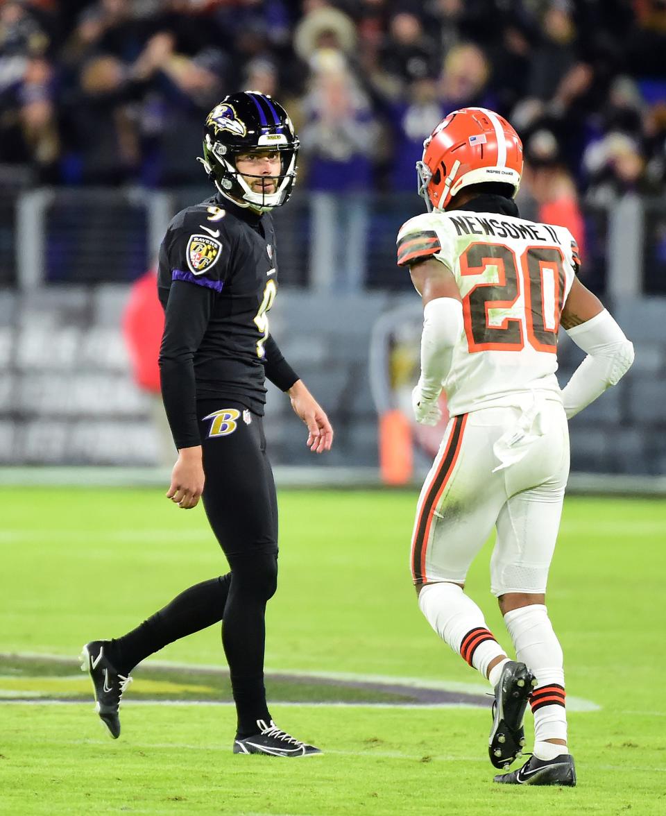 Nov 28, 2021; Baltimore, Maryland, USA; Baltimore Ravens kicker Justin Tucker (9) looks at Cleveland Browns cornerback Greg Newsome II (20) after making a field goal in the fourth quarter at M&T Bank Stadium. Mandatory Credit: Evan Habeeb-USA TODAY Sports