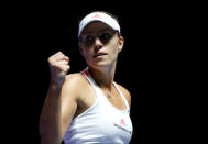 Tennis - Singapore WTA Finals Round Robin Singles - Singapore Indoor Stadium, Singapore - 25/10/2016 - Angelique Kerber of Germany celebrates a point against Simona Halep of Romania. REUTERS/Edgar Su