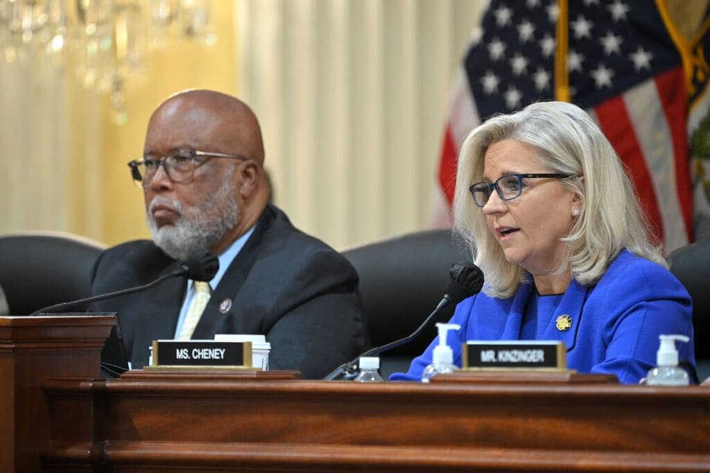 U.S. Representative Liz Cheney (R-Wy.) speaks flanked by U.S. Representative Bennie Thompson (D-Miss.), chairman of the House committee investigating the Capitol riot, during a House Select Committee hearing to Investigate the January 6th Attack on the US Capitol, in the Cannon House Office Building on Capitol Hill in Washington, DC on June 9, 2022. (Photo by MANDEL NGAN/AFP via Getty Images)