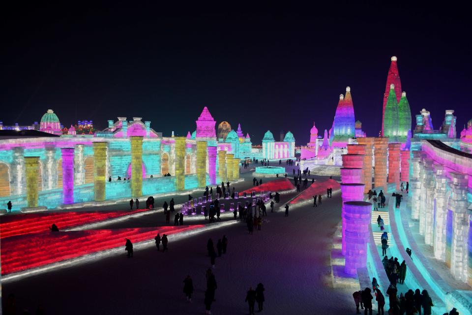 <p>Tourists enjoy spectacular ice and snow sculptures at the Harbin Ice and Snow World Park in Harbin, China, on Jan. 2. (Photo: Sipa Asia/REX/Shutterstock) </p>