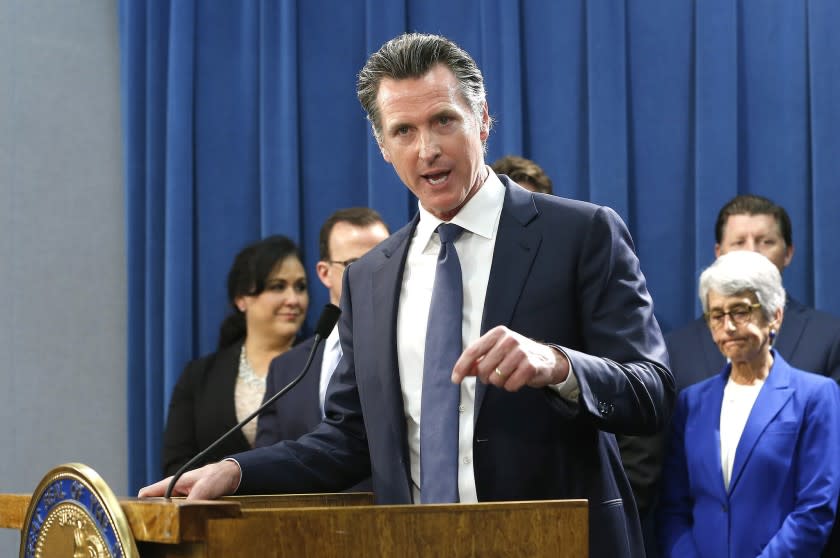 California Gov. Gavin Newsom, flanked by lawmakers from both houses of the legislature, discusses the weekend shooting at the Poway Chabad Synagogue north of San Diego during a news conference Monday, April 29, 2019, in Sacramento, Calif. Newsom said he would increase spending to pay for increasing security at nonprofit organizations at higher risk because of their ideology, beliefs or mission. (AP Photo/Rich Pedroncelli)