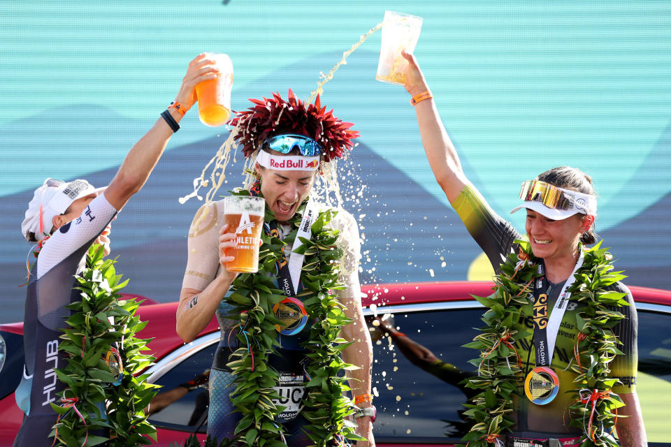 Winner Lucy Charles-Barclay is flanked by silver medalist Anne Haug (L) and bronze medalist Laura Philipp (R). (Sean M. Haffey/Getty Images for Ironman)