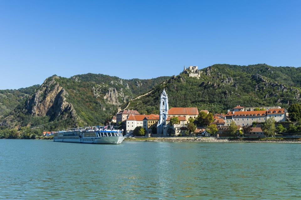 austria, wachau, cruise ship passing duernstein on the danube