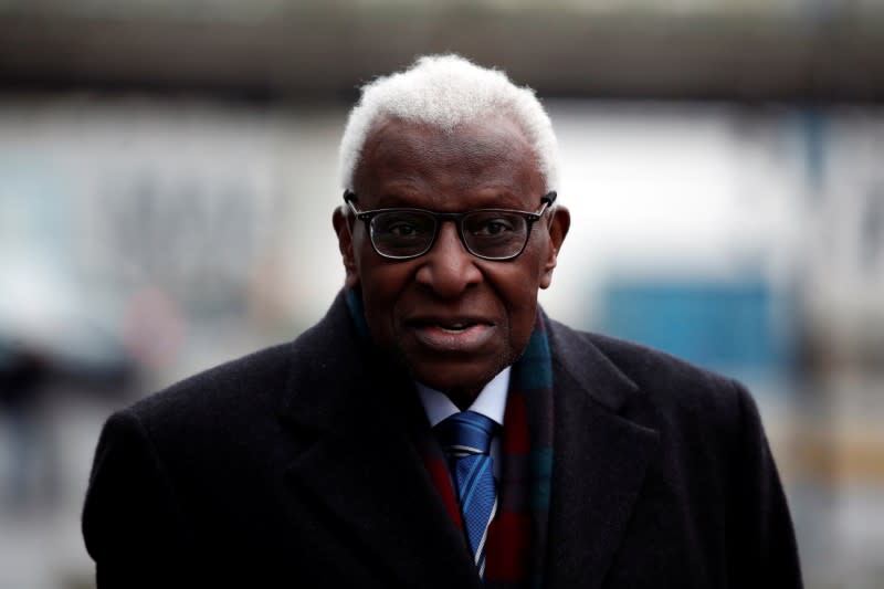 Former President of International Association of Athletics Federations (IAAF) Lamine Diack arrives for his trial at the Paris courthouse