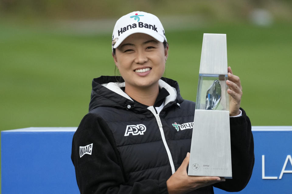 Minjee Lee of Australia celebrates with the winner's trophy after winning the BMW Ladies Championship at the Seowon Hills Country Club in Paju, South Korea, Sunday, Oct. 22, 2023. (AP Photo/Lee Jin-man)