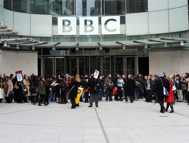 A crowd of people outside the BBC building