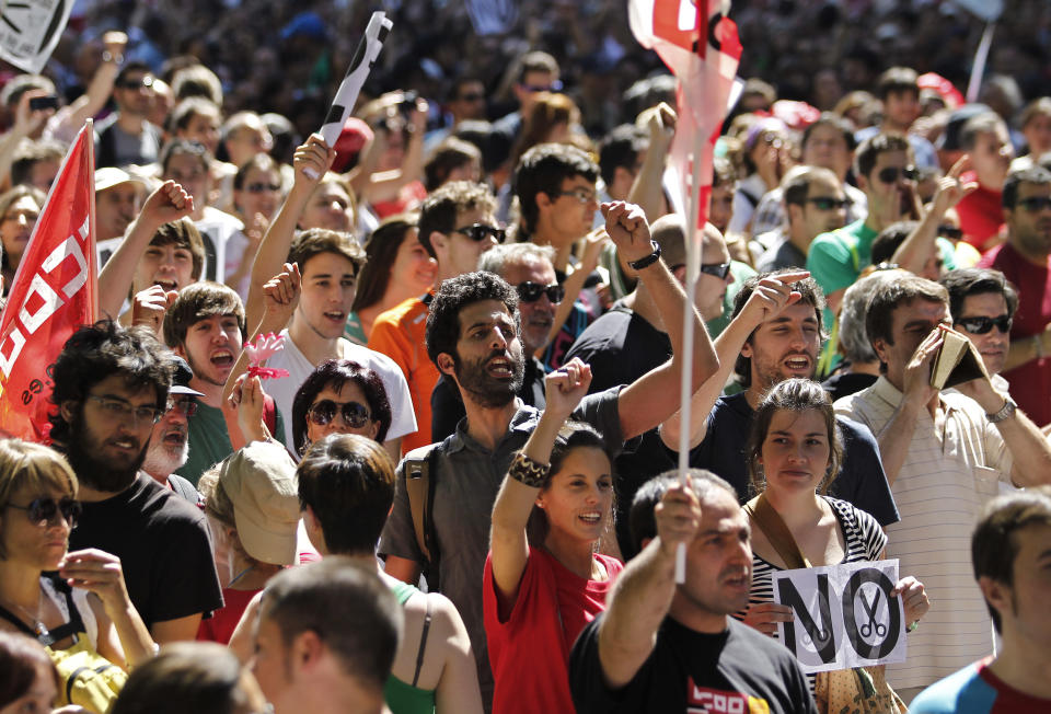 People protest against austerity measures applied by the Spanish government in Columbus Square, Madrid, Spain, Saturday, Sept. 15, 2012. Tens of thousands of people from all over the country converged on Madrid to hold a large anti-austerity demonstration on Saturday. (AP Photo/Andres Kudacki)