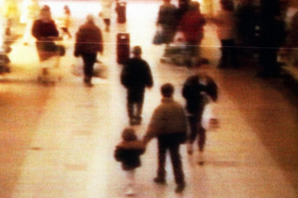 A CCTV camera shows the toddler being abducted from the Bootle Strand shopping centre in 1993. (BWP Media via Getty Images)