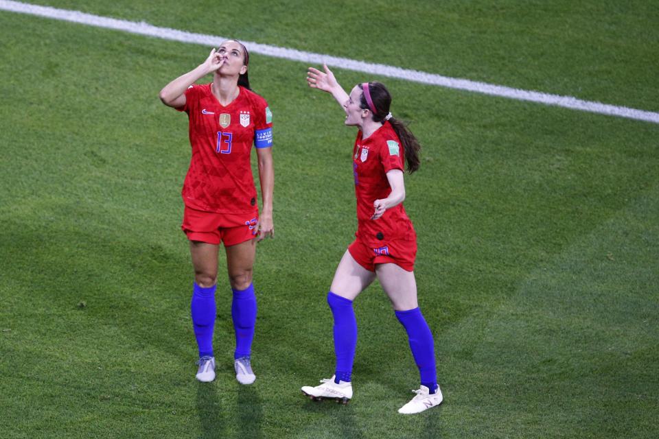 United States' Alex Morgan, left, celebrates her side's second goal during the Women's World Cup semifinal soccer match between England and the United States, at the Stade de Lyon outside Lyon, France, Tuesday, July 2, 2019. (AP Photo/Francois Mori)
