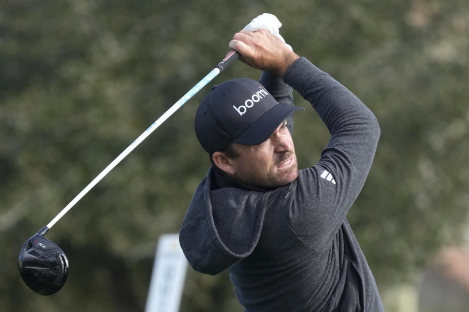 Nick Taylor, of Canada, hits his tee shot on the second hole during the continuation of the first round of the Phoenix Open golf tournament Friday, Feb. 9, 2024, in Scottsdale, Ariz. (AP Photo/Ross D. Franklin)